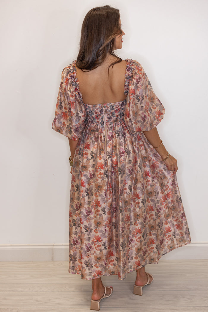 Women's champagne and multicolor floral chiffon midi dress with smocked bodice by Sofie the Label showing full back view