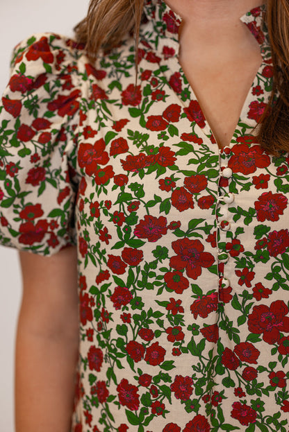 Women's ecru midi dress with burgundy, pink and green floral print by Entro showing button front bodice and v neck line detail