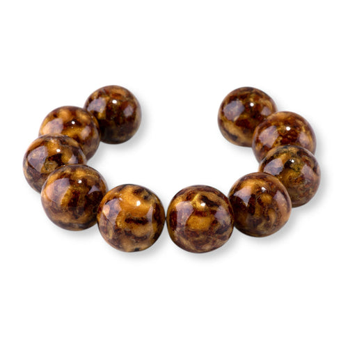 This is a Dakota Stones 20mm Beehive Gemstone strand with round beads in 8 inch strand.