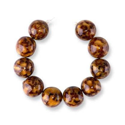 This is a Dakota Stones 20mm Beehive Gemstone strand with round beads in 8 inch strand.