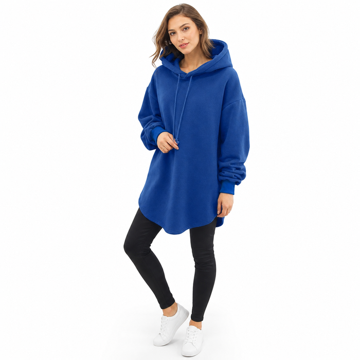 Women's longline hoodie shown from front with drawstring hood, drop shoulders, and an extended hem for casual outfit styling.