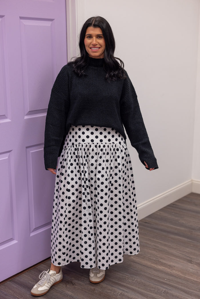 Women's black polka dot maxi skirt by Day + Moon showing full front view