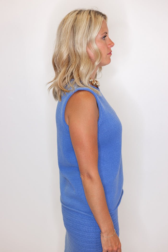 Women's blue sweater knit maxi skirt with matching sleeveless contrasting knit top by Wishlist showing up close side view of top