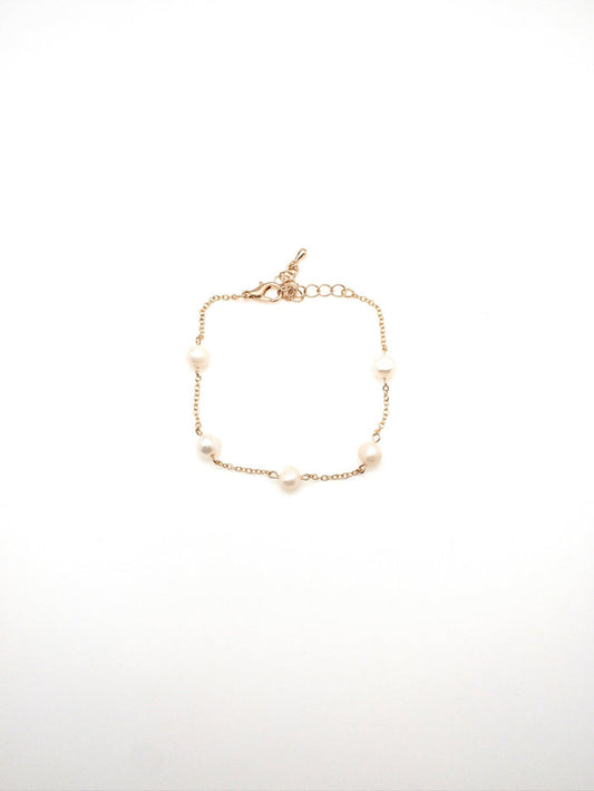 Scattered pearls on gold chain bracelet adjustable