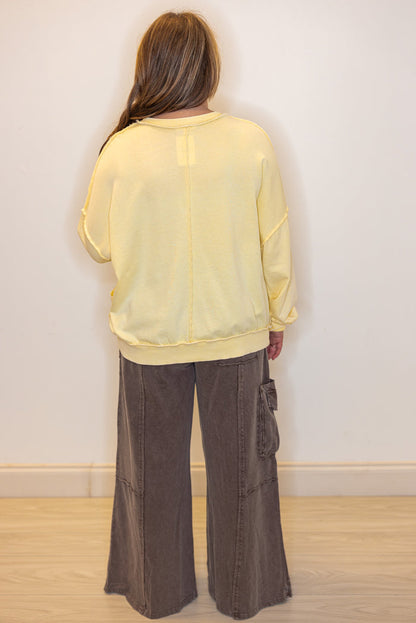 Mineral washed lemon yellow pullover top with front pockets by Easel showing full back view