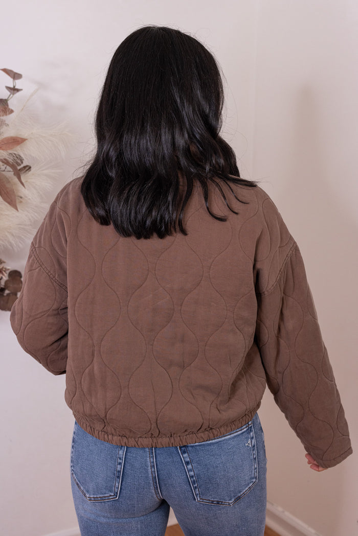 Women's washed brown quilted puffer jacket with bow ties down the front by Blu Pepper showing up close back view