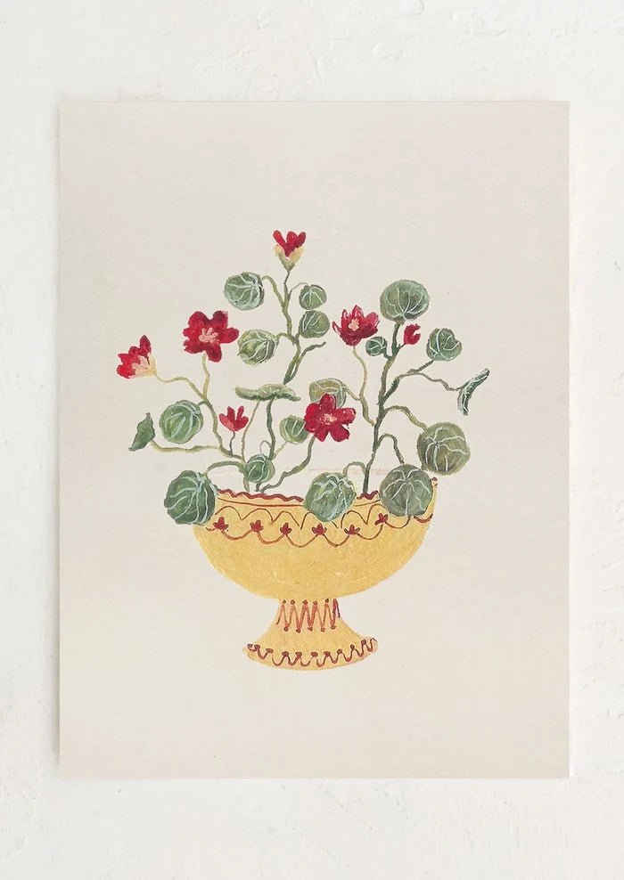 An art print of a painting of crimson nasturtiums in a yellow compote bowl.