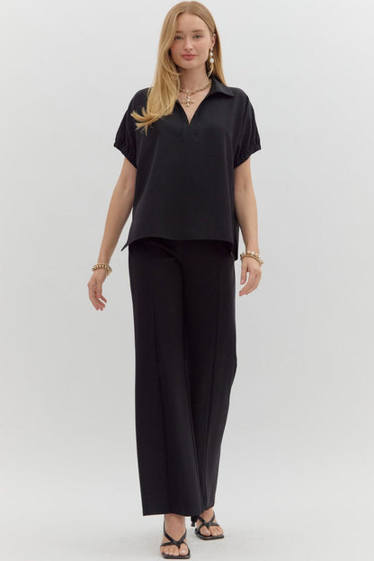 Women's black short sleeve top by Entro showing full front view