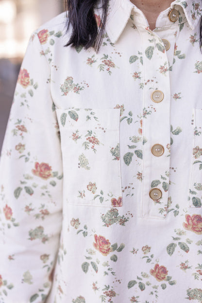 Women's cream denim floral print dress with button front bodice by In February showing button details