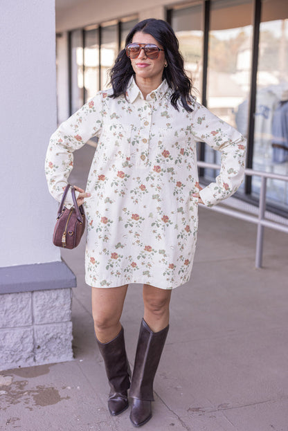 Women's cream denim floral print dress with button front bodice by In February showing button details showing true to size fit