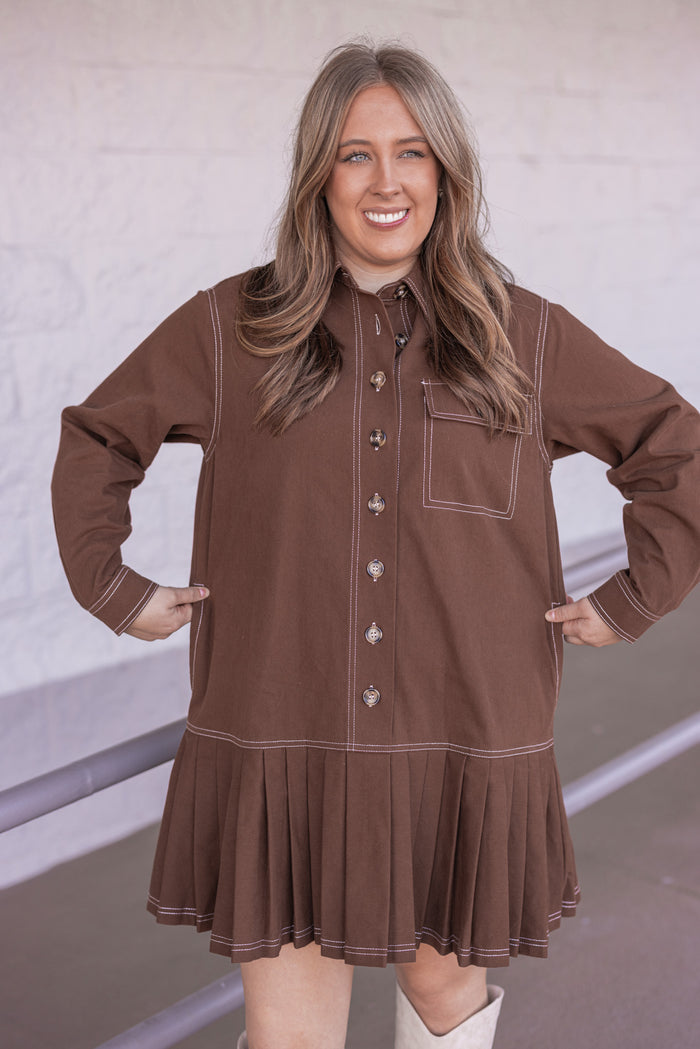 Women's brown denim twill button front dress with cream stitching trim by Entro showing true to size fit