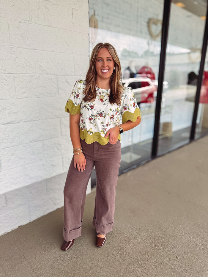 Women's ecru multicolor floral print top with moss green scalloped trim by Entro  showing full front view