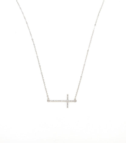 Silver sideways cross necklace.