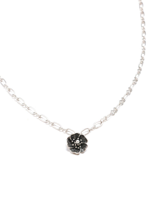 Close-up of a silver necklace with a five-petal flower pendant and dual-link chain – Five Fold Bloom Necklace in antiqued silver