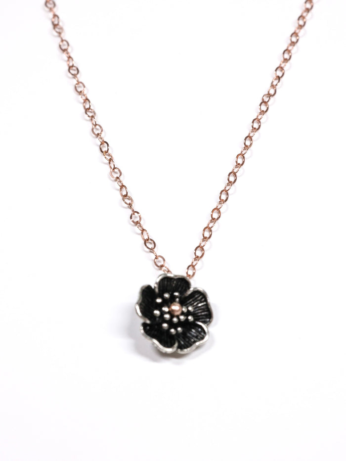 Close-up of a rose gold necklace with a five-petal flower pendant and dual-link chain – Five Fold Bloom Necklace in rose gold