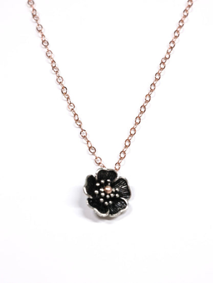 Close-up of a rose gold necklace with a five-petal flower pendant and dual-link chain – Five Fold Bloom Necklace in rose gold