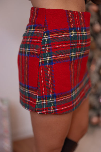 Women's red, green and navy plaid flannel skort with slit in hem by Day + Moon showing up close side view