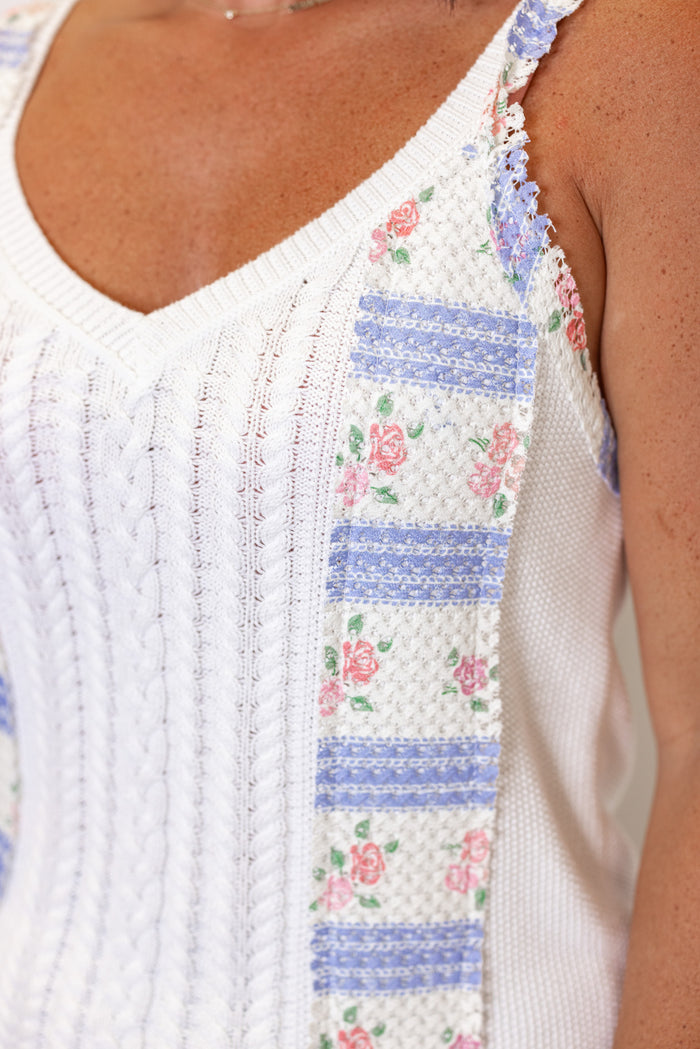 Women's off white sweater knit tank top with pink and blue floral patches by POL showing up close view of floral patch detailing
