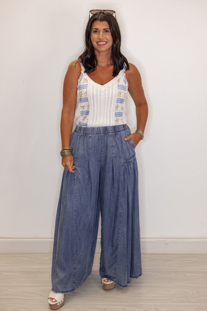 Palazzo style wide leg chambray denim pants in dark blue by Easel showing full front view