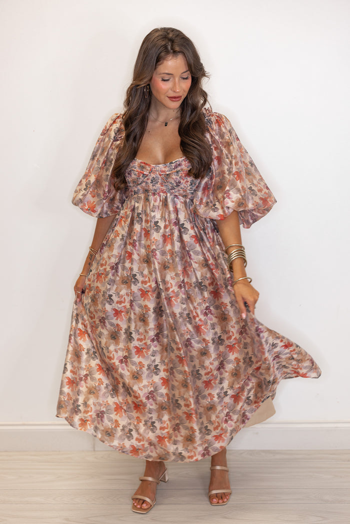 Women's champagne and multicolor floral chiffon midi dress with smocked bodice by Sofie the Label showing flowy skirt