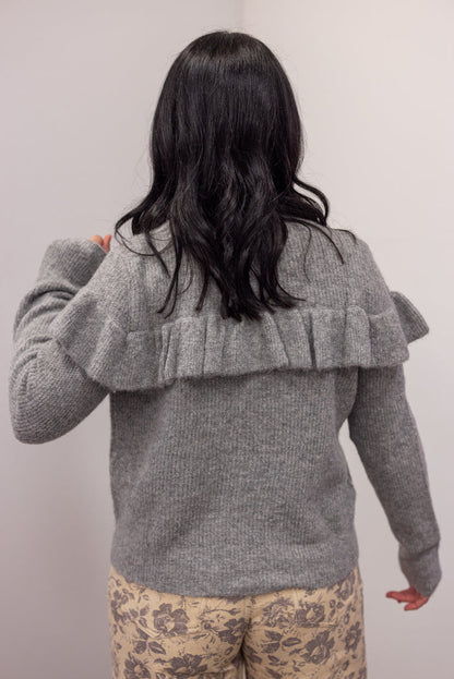Women's grey knit sweater with a ruffle across the front chest and back shoulders by Wishlist showing up close back view