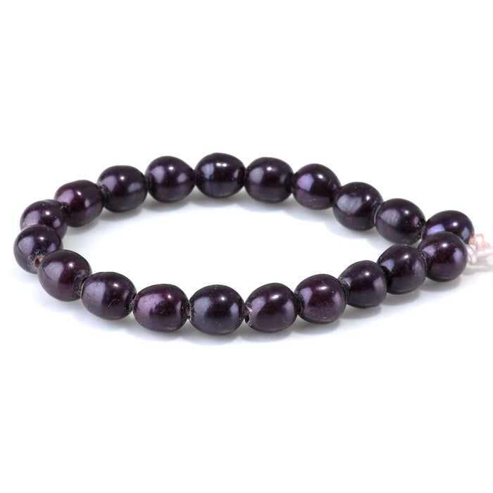 This is a Dakota Stones 10-12mm Freshwater Pearl Purple Rice Large Gemstone strand of round beads in 8 inch strand.