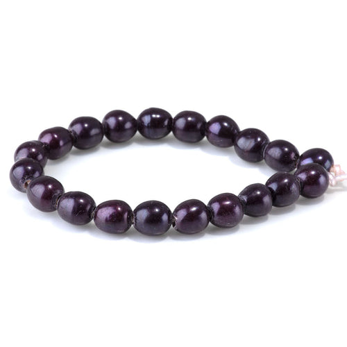 This is a Dakota Stones 10-12mm Freshwater Pearl Purple Rice Large Gemstone strand of round beads in 8 inch strand.