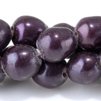 This is a Dakota Stones 10-12mm Freshwater Pearl Purple Rice Large Gemstone strand of round beads in 8 inch strand.