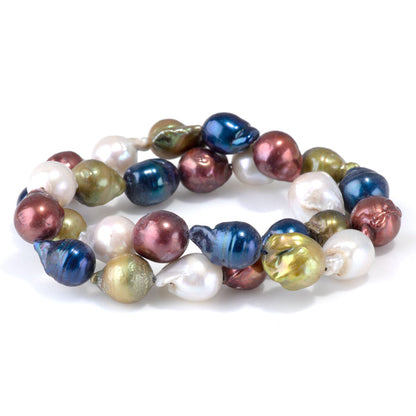 This is a Dakota Stones 12x10-15mm Freshwater Pearl Color Mix Baroque Gemstone strand of round beads in 15-16 inch strand.