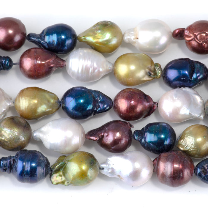 This is a Dakota Stones 12x10-15mm Freshwater Pearl Color Mix Baroque Gemstone strand of round beads in 15-16 inch strand.
