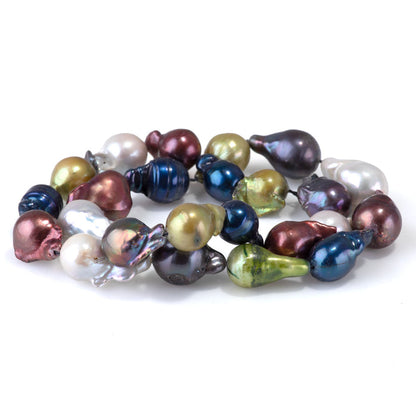 This is a Dakota Stones 12x10-15mm Freshwater Pearl Color Mix Baroque Gemstone strand of round beads in 15-16 inch strand.
