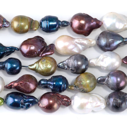 This is a Dakota Stones 12x10-15mm Freshwater Pearl Color Mix Baroque Gemstone strand of round beads in 15-16 inch strand.