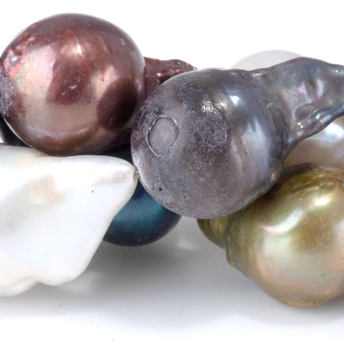 This is a Dakota Stones 12x10-15mm Freshwater Pearl Color Mix Baroque Gemstone strand of round beads in 15-16 inch strand.