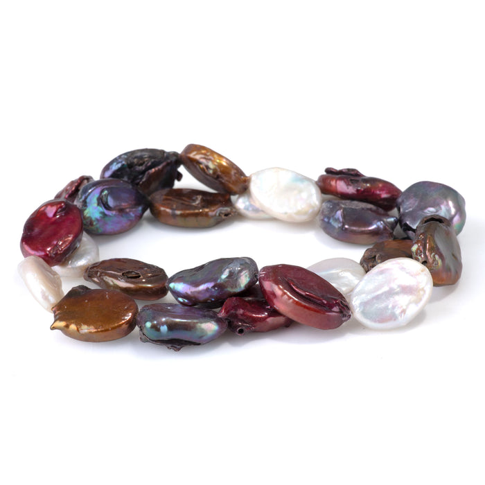 This is a Dakota Stones 14x15-17mm Freshwater Pearl Color Mix Flat Gemstone strand with oval beads in 15-16 inch strand.