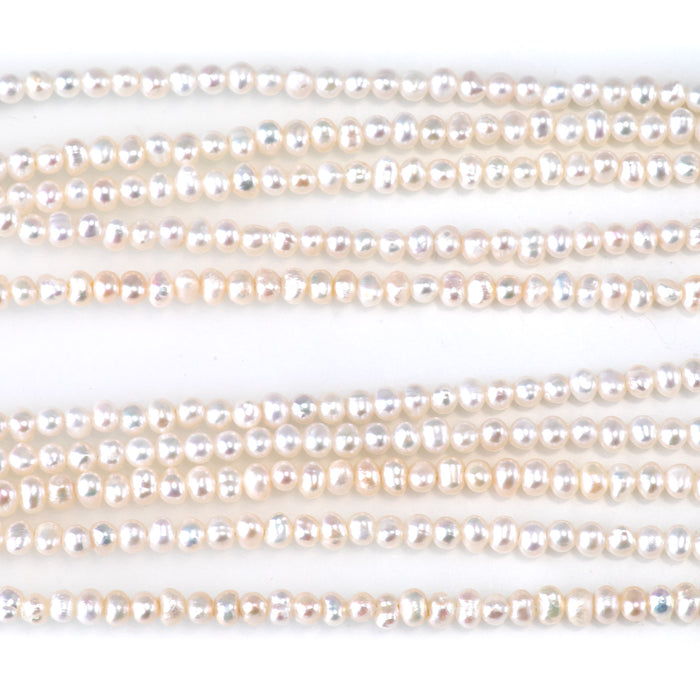 This is a Dakota Stones 3-4mm Freshwater Pearl White Potato Gemstone strand of round beads in 15-16 inch strand.