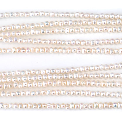 This is a Dakota Stones 3-4mm Freshwater Pearl White Potato Gemstone strand of round beads in 15-16 inch strand.
