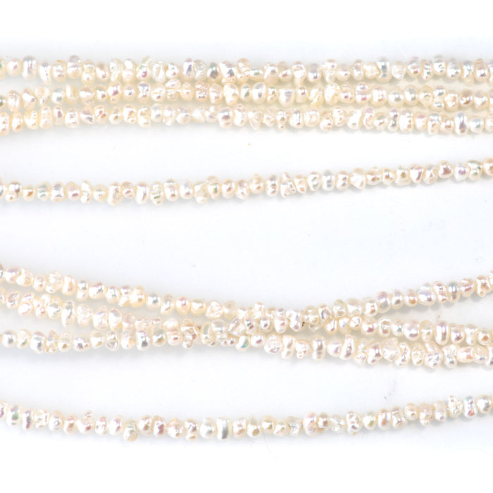 This is a Dakota Stones 3mm Freshwater Pearl White Cispy Potato Gemstone strand of round beads in 15-16 inch strand.