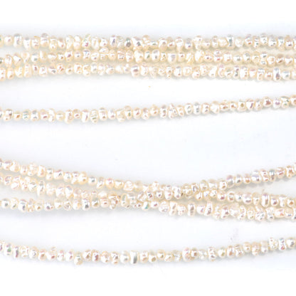 This is a Dakota Stones 3mm Freshwater Pearl White Cispy Potato Gemstone strand of round beads in 15-16 inch strand.