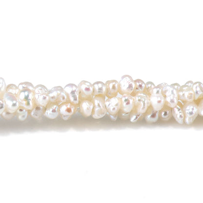 This is a Dakota Stones 3mm Freshwater Pearl White Cispy Potato Gemstone strand of round beads in 15-16 inch strand.