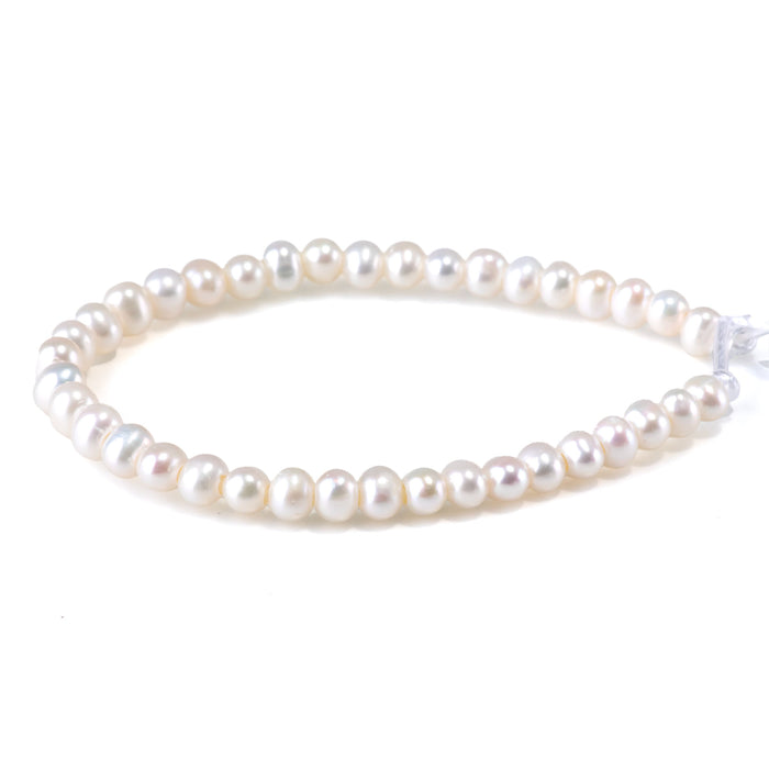 This is a Dakota Stones 6-7mm Freshwater Pearl White Large Hole Gemstone strand with oval beads in 8 inch strand.