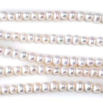 This is a Dakota Stones 6-7mm Freshwater Pearl White Large Hole Gemstone strand with oval beads in 8 inch strand.