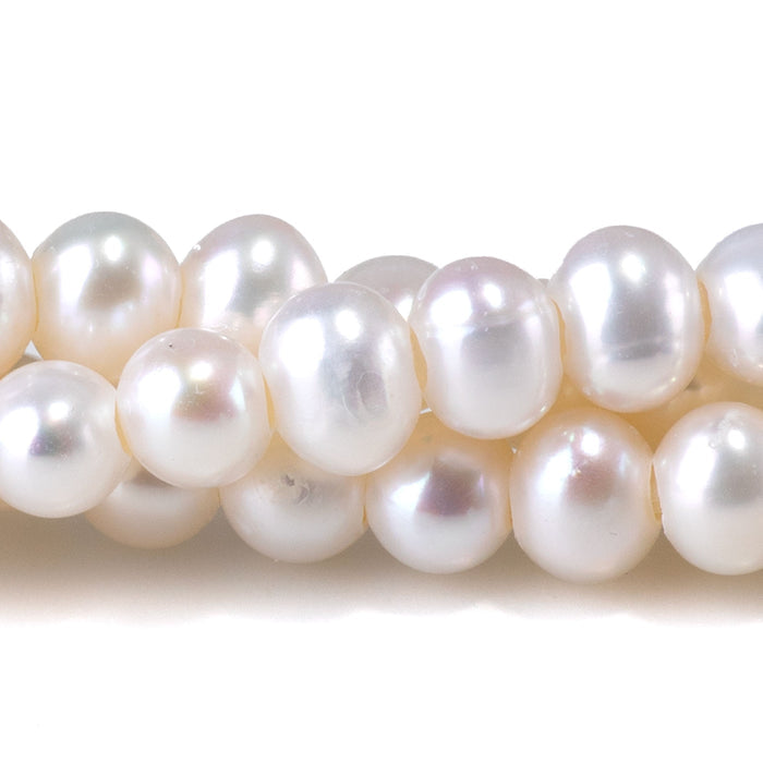 This is a Dakota Stones 6-7mm Freshwater Pearl White Large Hole Gemstone strand with oval beads in 8 inch strand.