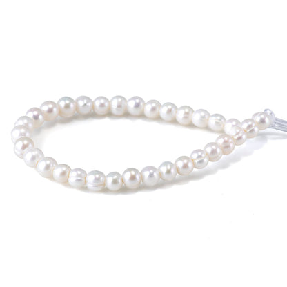 This is a Dakota Stones 6-7mm Freshwater Pearl White Potato Large Gemstone strand of round beads in 8 inch strand.