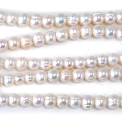 This is a Dakota Stones 6-7mm Freshwater Pearl White Potato Large Gemstone strand of round beads in 8 inch strand.
