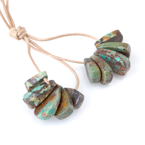 This is a Dakota Stones 9x11-16mm Hubei Turquoise Brown Green Corn Gemstone strand of round beads.