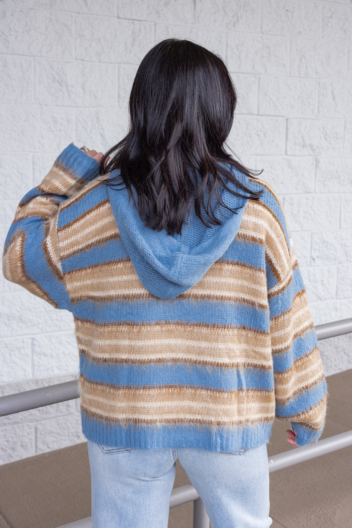 Women's blue and tan striped sweater knit jacket with a zipper front and hood by Mustard Seed showing up close back view