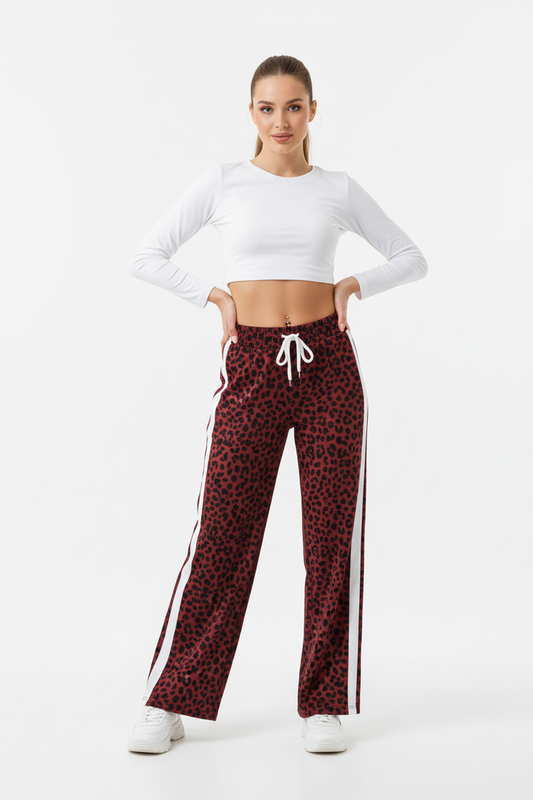 Red leopard patchwork pants worn with a black cami for a bold evening styling idea