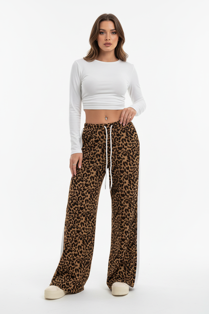 Coffee-toned leopard wide-leg pants styled with pointed mules for a smart-casual outfit
