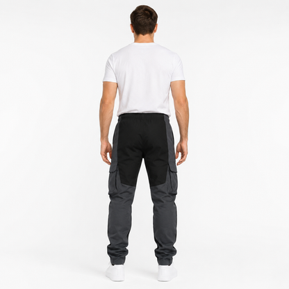 Men's black loose fit cargo trousers back view with charcoal leg panels and tapered fit