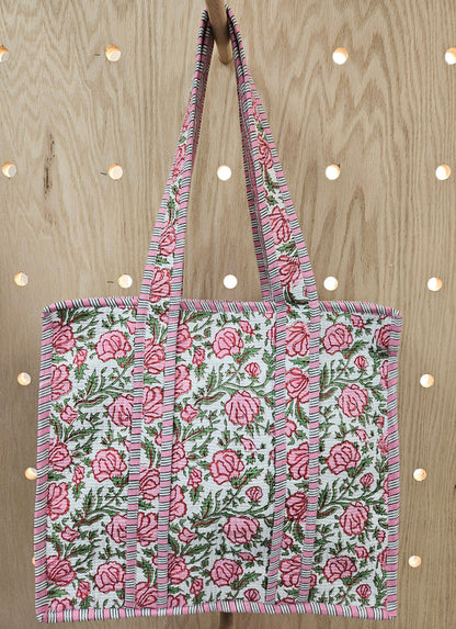 pink quilted bag with handle